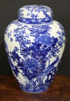 A Japanese porcelain ovoid ginger jar and cover, painted in tones of underglaze blue with the