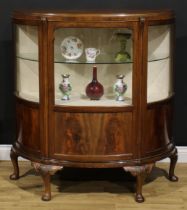 A George II Revival walnut demi-lune side cabinet, moulded top above a glazed door and rectangular