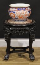A Chinese hongmu and mother of pearl marquetry jardiniere stand, shaped circular top with beaded