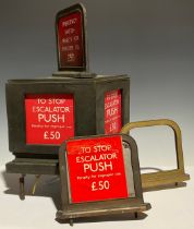 A London Underground bronze escalator "Emergency Switch", one original red card, other