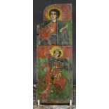 An Eastern orthodox panel or icon section, painted in polychrome with saints, inscribed to verso,