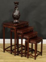 A Chinese hardwood quartetto nest of occasional tables, rectangular panel tops, humpback stretchers,