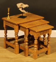 An oak nest of three occasional tables, by Rupert/Nigel Griffiths Monastic Woodcraft, the largest