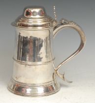 A George III silver spreading cylindrical tankard, hinged domed cover with chairback thumbpiece, S-