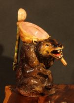 A Victorian majolica novelty syrup jug, by Joseph Holdcroft, as a seated bear holding a spoon,