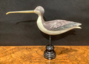 A painted softwood avian decoy, carved as a curlew, turned display stand, 32cm high