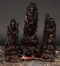 A Chinese hardwood arrangement of figures, carved as Shou-Lao and immortals, 22cm wide