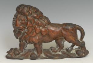 A 19th century bronze door stop, cast as a lion, 22cm long