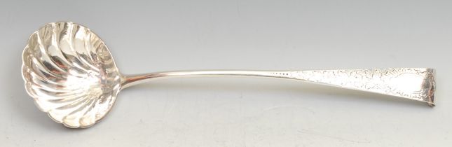 A George III Irish silver Old English pattern soup ladle, shell bowl, chased stem, 36cm long, Dublin