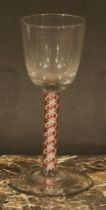 A George III coloured twist drinking glass, opaque red and white helix twist stem, domed circular