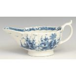 A rare Worcester The Mission Church pattern fluted sauceboat, decorated in underglaze blue with a