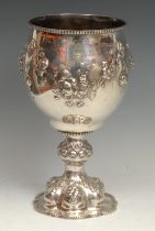 Hunting & Horse Racing - a large Victorian silver presentation goblet, chased with flowers and