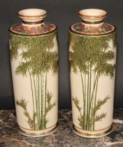 A pair of Japanese Meiji period Satsuma cylindrical vases, slightly tapering, decorated with leafy