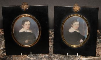 English School, 19th century, a pair of portrait miniatures, of young boys, each inscribed to verso,
