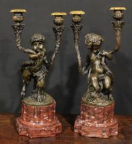 A pair of Louis XVI Revival patinated bronze two-light candelabra, after Claude Michel and Louis