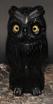 An early 20th century ebonised novelty string box, as an owl, glass eyes, 18.5cm high