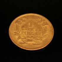 Coins - an American gold dollar, 1854