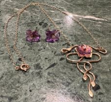 A diamond and amethyst pendant and similar earrings suite, Art Nouveau style serpentine floral