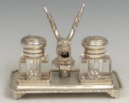 A Chinese silver rectangular inkstand, centred by a deer flanked by a pair of square glass wells, on