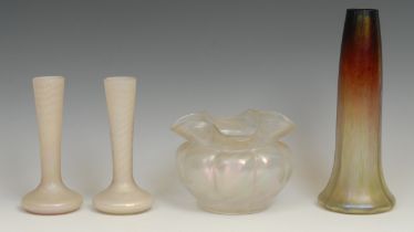 A Loetz type lobed ovoid vase, in iridescent opalescent tones, 10.5cm; a similar pair of