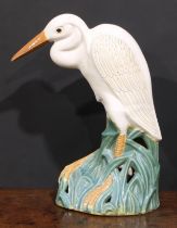 A large mid-20th century Bohemian ceramic model, possibly Bechyně, of an egret, 63cm high