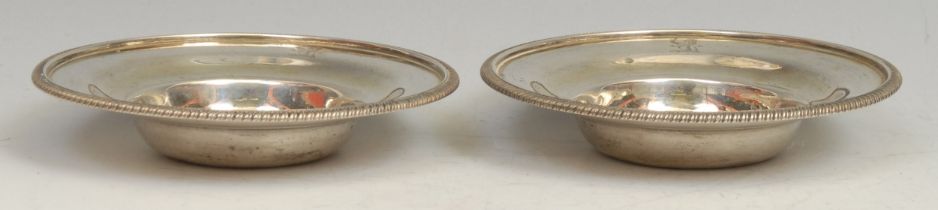 A pair of George III silver ogee nut dishes, gadrooned borders, 12cm diam, John Robins, London 1806,