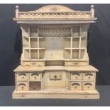 An early 20th century scratch built painted model, of a grocer's shop cabinet, gallery top with