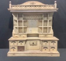An early 20th century scratch built painted model, of a grocer's shop cabinet, gallery top with