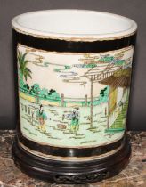 A large Chinese bitong brush pot, painted in polychrome with silk makers at work, on a noir