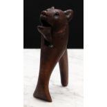 Nutcrackers - a Black Forest novelty lever-action nut cracker, carved as the head of a bear, glass
