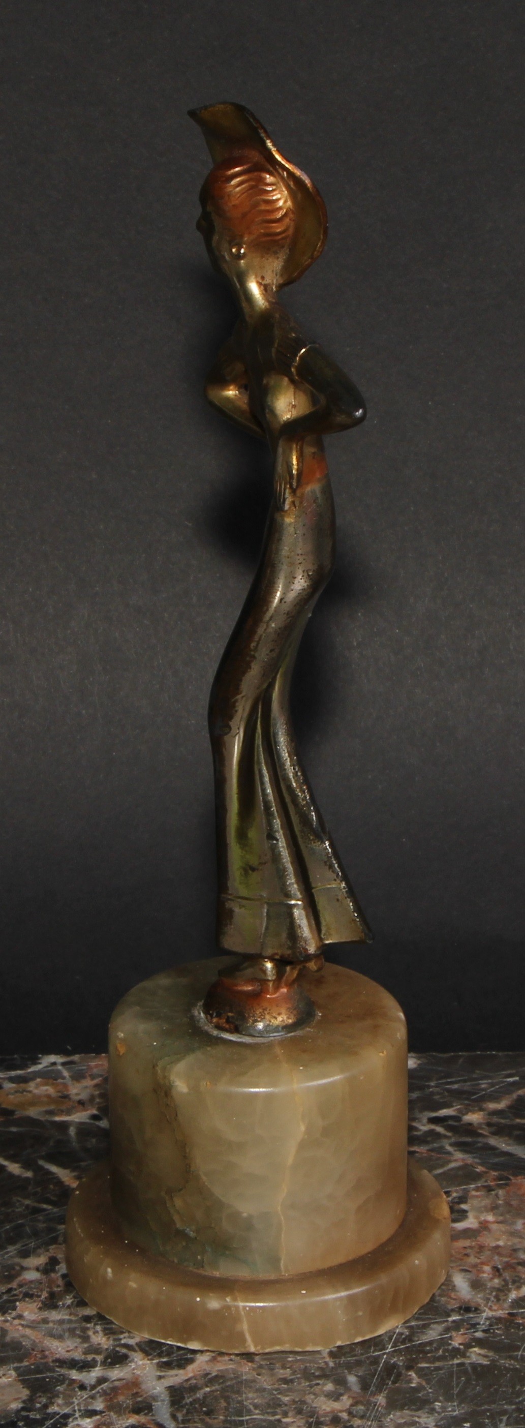 An Art Deco gilt and silvered figure, a lady of fashion, onyx plinth, 20.5cm high, c.1940 - Image 3 of 3