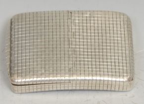 A George III silver curved rounded rectangular snuff box, chequered overall, the cover flush-