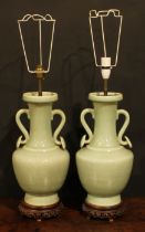 A pair of Chinese celadon ovoid vases, fitted as table lamps, ruyi sceptre handles, hardwood