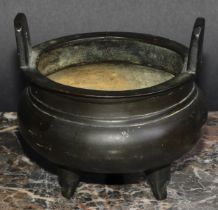 A Chinese bronze tripod ding censer, angular lug handles, 12.5cm diam, six character mark