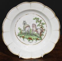 A Worcester Aesop Fable shaped circular plate, painted in polychrome with horses, osier border, gilt