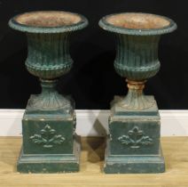 A pair of 19th century style cast iron fluted campana garden urns, each with egg-and-dart rim,