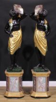A pair of Venetian parcel-gilt and polychrome painted blackamoor torcheres, each carved as a Nubian
