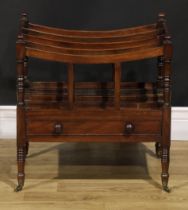 A George IV mahogany four-section Canterbury, turned finials, bowed divisions, drawer to frieze,