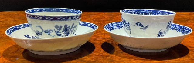 A Liverpool Barbed Chain and Daisy Spray pattern tea bowl and saucer, decorated in underglaze