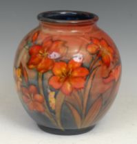 A Moorcroft Freesia pattern globular vase, 22cm high, script signature, impressed mark