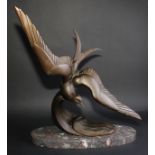 An Art Deco design dark patinated spelter model, of a diving tern, in the manner of Irénée