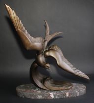 An Art Deco design dark patinated spelter model, of a diving tern, in the manner of Irénée