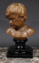 A Continental boxwood bust, well carved as a putto, turned ebonised base, 19.5cm high, 19th/early