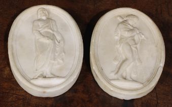 A pair of 19th century Grand Tour marble oval bas relief tablets, carved after the antique, 14.5cm x