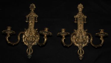 A pair of French Transitional style gilt metal wall lights, the plates cast with an anthemion,