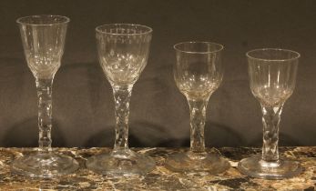 A George III drinking glass, quarter facet cut bowl, facet cut stem, domed circular foot, 12cm high,