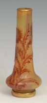 A French Daum Nancy cameo glass bottle vase, incised with red thistles on an iridescent mottled