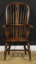 A 19th century ash and elm Windsor elbow chair, hoop back, shaped and pierced splat, turned arm