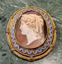 A 19th century gold coloured metal Etruscan Revival "Grand Tour" reversible carved shell cameo and