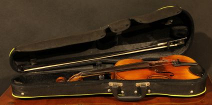 A violin, the two-piece back 36cm long excluding button, paper Stradivarius label, ebonised tuning